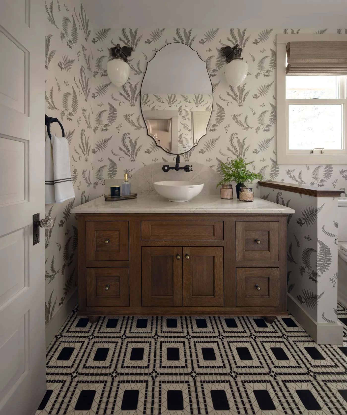 Farmhouse bathroom with patterned black and white floor tile