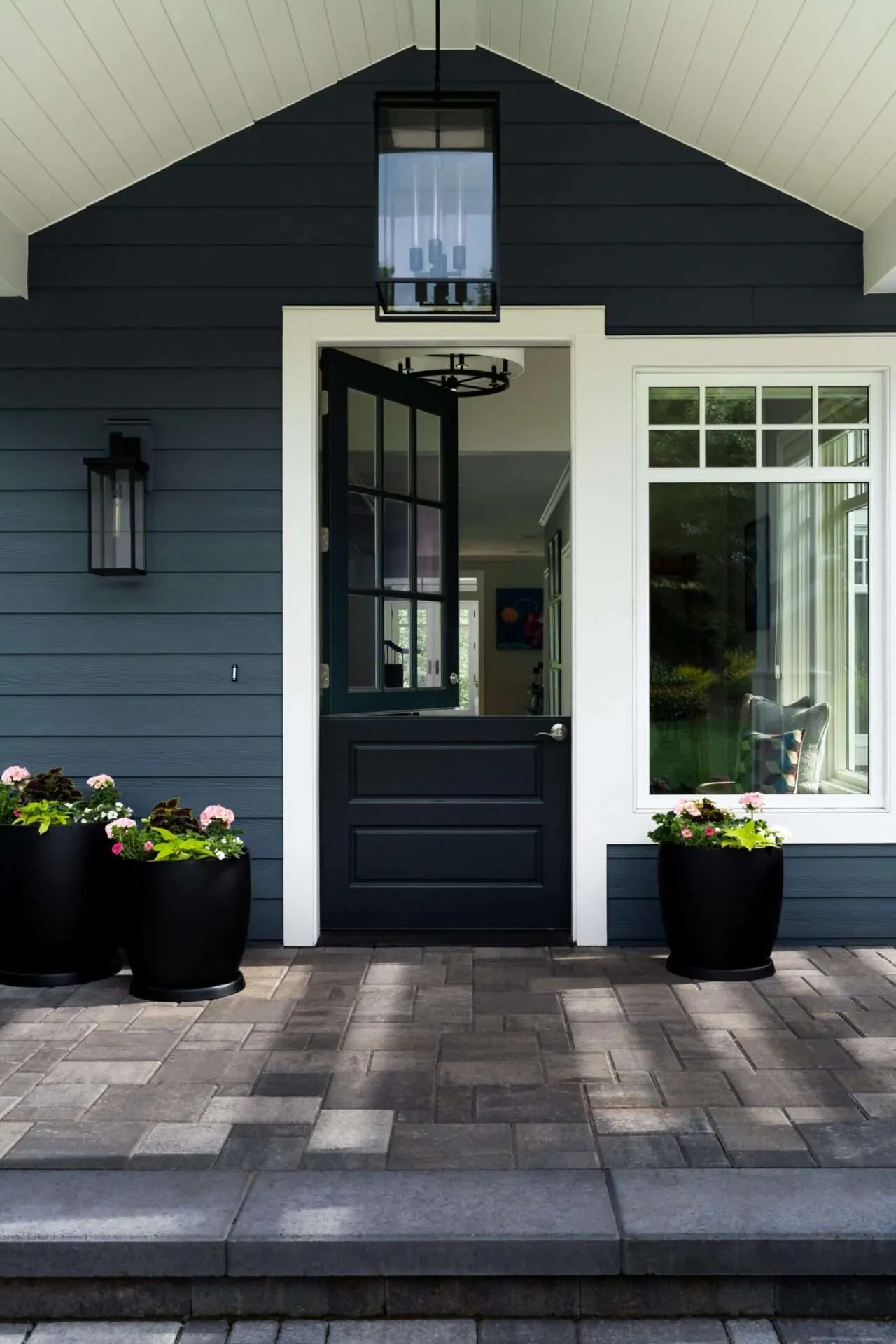 Exterior of a remodeled home with dark siding